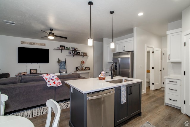 2165 W 380 S, Hurricane, UT 84737 - kitchen featuring appliances with stainless steel finishes, open floor plan, dark wood-style floors, white cabinetry, and ceiling fan