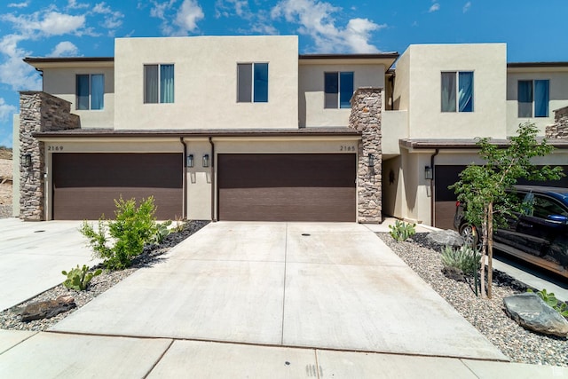 2165 W 380 S, Hurricane, UT 84737 - view of front of house with concrete driveway, stucco siding, and a garage