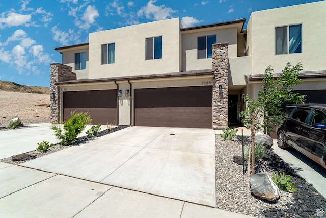 2165 W 380 S, Hurricane, UT 84737 - view of front of property featuring stucco siding, a garage, and driveway