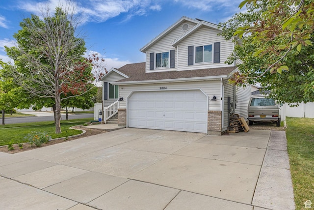 5884 S Impressions Dr W, Salt Lake City, UT 84118 - traditional home featuring driveway, a garage, brick siding, and a front yard