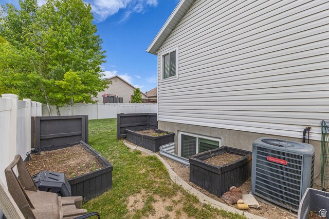 5884 S Impressions Dr W, Salt Lake City, UT 84118 - view of yard with a vegetable garden and cooling unit