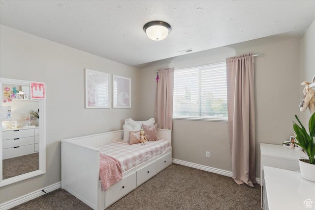 bedroom featuring carpet and baseboards