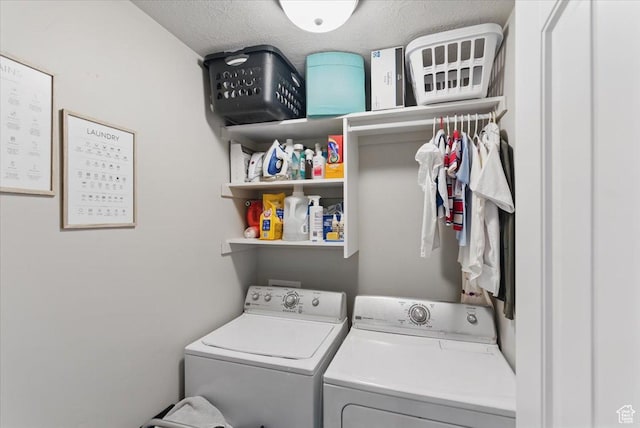 clothes washing area with separate washer and dryer