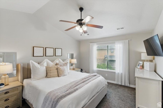 bedroom featuring lofted ceiling, dark carpet, baseboards, and ceiling fan