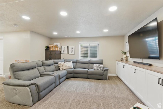 living area featuring light colored carpet, recessed lighting, and baseboards