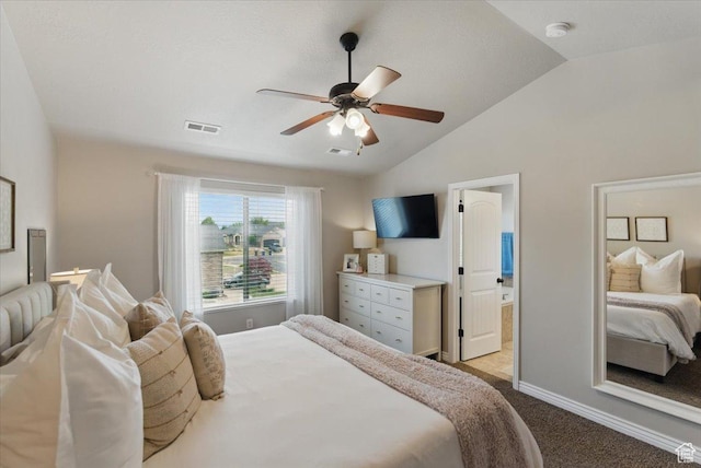 bedroom featuring carpet, lofted ceiling, baseboards, ceiling fan, and connected bathroom