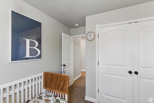 bedroom featuring a closet, carpet floors, and baseboards
