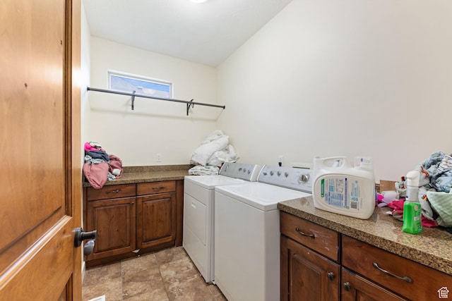 laundry area featuring independent washer and dryer and cabinet space