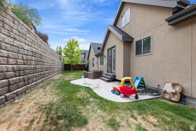 view of yard with a patio and entry steps