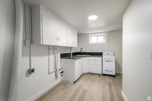 3671 Eccles Ave, Ogden, UT 84403 - laundry area with light wood-type flooring and baseboards
