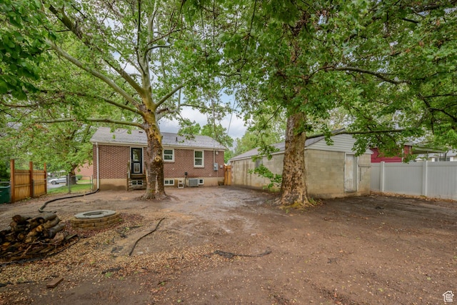 3671 Eccles Ave, Ogden, UT 84403 - rear view of property with fence and brick siding