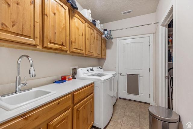 881 W Smithsonian Way, Apple Valley, UT 84737 - laundry area with cabinet space, washer and dryer, and light tile patterned flooring
