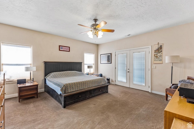881 W Smithsonian Way, Apple Valley, UT 84737 - carpeted bedroom featuring french doors, access to exterior, baseboards, a textured ceiling, and a ceiling fan