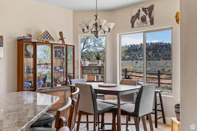 881 W Smithsonian Way, Apple Valley, UT 84737 - dining area featuring a chandelier, healthy amount of natural light, and light tile patterned floors