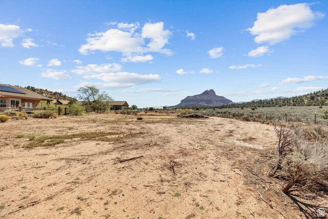 881 W Smithsonian Way, Apple Valley, UT 84737 - view of yard with fence, a mountain view, and a view of countryside