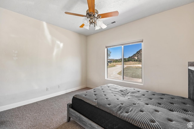 881 W Smithsonian Way, Apple Valley, UT 84737 - carpeted bedroom featuring baseboards and a ceiling fan
