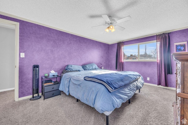 bedroom featuring carpet, a textured ceiling, ceiling fan, and baseboards