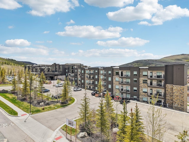 909 W Peace Tree Trl Unit 513, Kamas, UT 84036 - view of apartment building / complex featuring a mountain view and uncovered parking