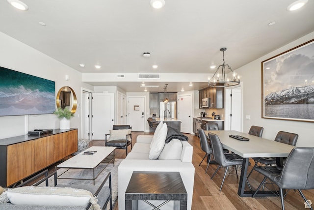 909 W Peace Tree Trl Unit 513, Kamas, UT 84036 - living area with wood finished floors, a chandelier, and recessed lighting