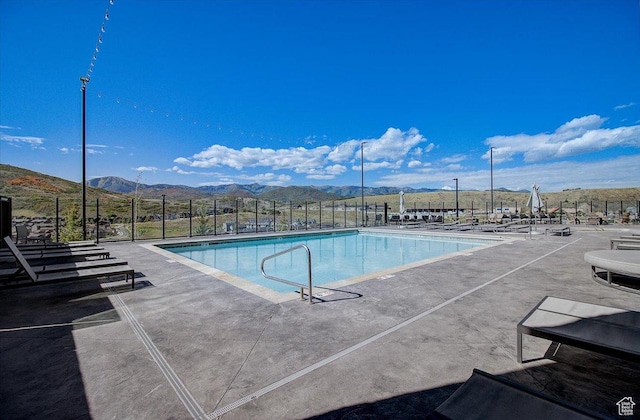 909 W Peace Tree Trl Unit 513, Kamas, UT 84036 - community pool featuring fence, a mountain view, and a patio