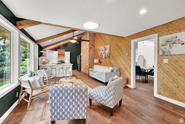 3348 E Stonehill Ln, Cottonwood Heights, UT 84121 - living room featuring plenty of natural light, wooden walls, ceiling fan, baseboards, and wood finished floors