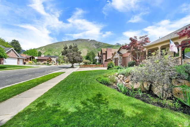 3348 E Stonehill Ln, Cottonwood Heights, UT 84121 - view of grassy yard featuring a mountain view and a residential view
