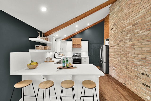 3348 E Stonehill Ln, Cottonwood Heights, UT 84121 - kitchen with stainless steel appliances, a peninsula, beamed ceiling, open shelves, and light wood finished floors