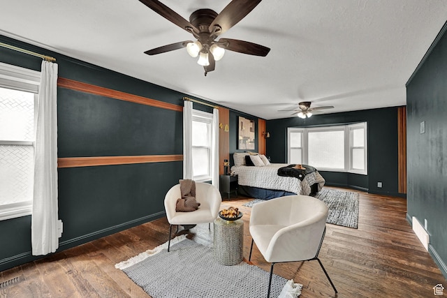 3348 E Stonehill Ln, Cottonwood Heights, UT 84121 - bedroom with wood finished floors, a ceiling fan, and baseboards