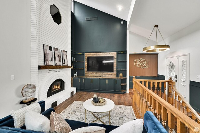 3348 E Stonehill Ln, Cottonwood Heights, UT 84121 - living room with dark wood-type flooring, a brick fireplace, and high vaulted ceiling
