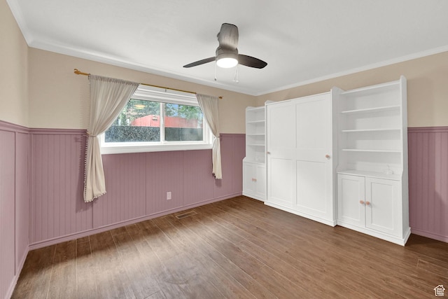 3348 E Stonehill Ln, Cottonwood Heights, UT 84121 - unfurnished bedroom featuring wood finished floors, a wainscoted wall, crown molding, and a ceiling fan