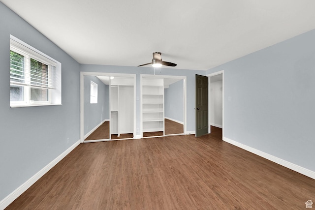 3348 E Stonehill Ln, Cottonwood Heights, UT 84121 - unfurnished bedroom with dark wood finished floors, baseboards, and a ceiling fan