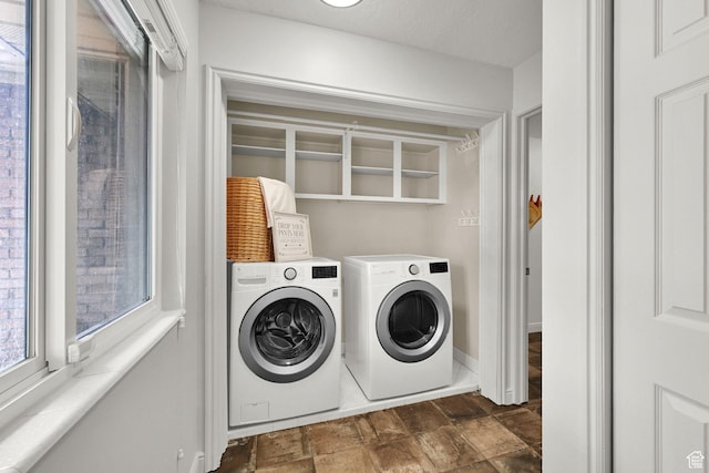 3348 E Stonehill Ln, Cottonwood Heights, UT 84121 - washroom with washing machine and clothes dryer, stone finish flooring, and baseboards