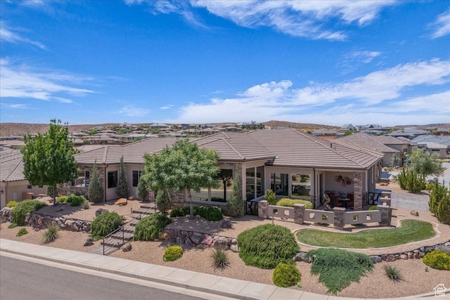1865 N Park Grove Dr, Washington, UT 84780 - ranch-style house featuring a tiled roof, a residential view, a patio, and stucco siding