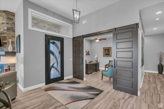 1865 N Park Grove Dr, Washington, UT 84780 - foyer entrance featuring a barn door, light wood-type flooring, baseboards, and recessed lighting