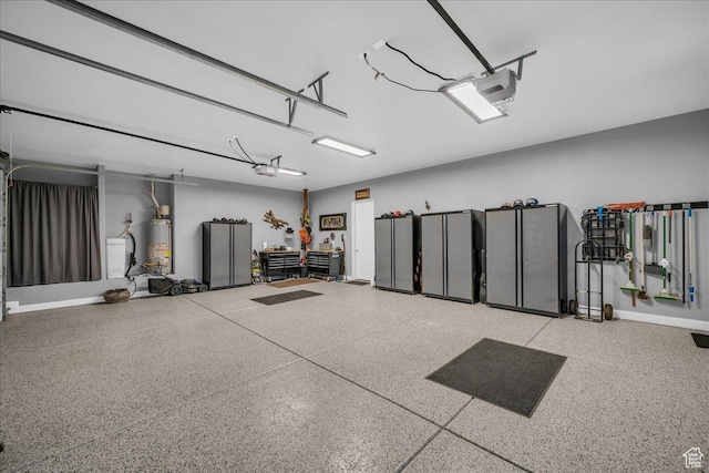 1865 N Park Grove Dr, Washington, UT 84780 - garage featuring gas water heater, a garage door opener, and baseboards