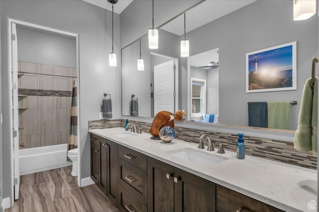 1865 N Park Grove Dr, Washington, UT 84780 - bathroom with decorative backsplash, double vanity, toilet, and shower / tub combo with curtain