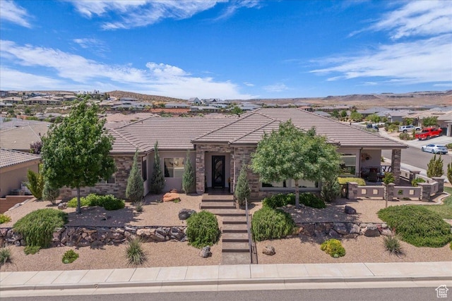 1865 N Park Grove Dr, Washington, UT 84780 - view of front facade featuring a tile roof and a mountain view