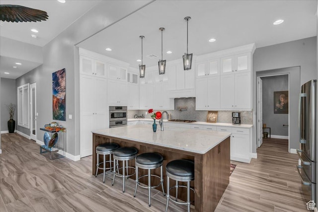1865 N Park Grove Dr, Washington, UT 84780 - kitchen with appliances with stainless steel finishes, baseboards, tasteful backsplash, and recessed lighting