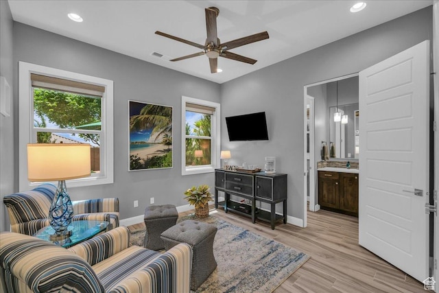 1865 N Park Grove Dr, Washington, UT 84780 - living area featuring plenty of natural light, ceiling fan, baseboards, light wood-type flooring, and recessed lighting