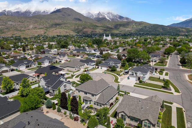 aerial view of residential area featuring mountains