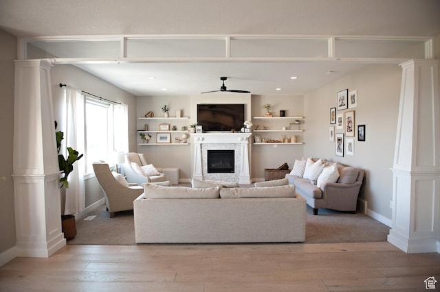 224 S Dry Creek Ln W, Vineyard, UT 84058 - living area with decorative columns, a glass covered fireplace, ceiling fan, light wood-style floors, and recessed lighting
