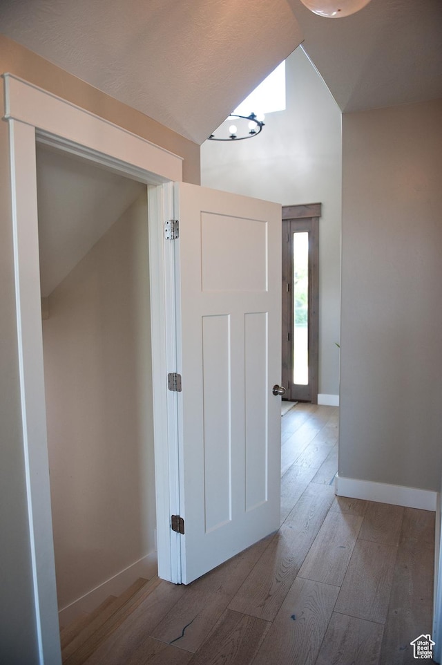 224 S Dry Creek Ln W, Vineyard, UT 84058 - hall with hardwood / wood-style flooring, baseboards, and vaulted ceiling