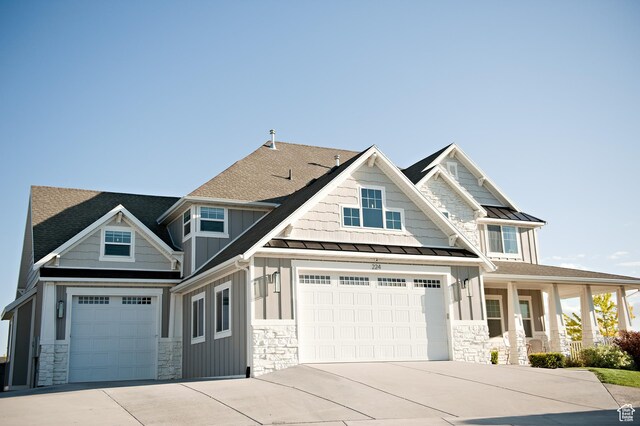 224 S Dry Creek Ln W, Vineyard, UT 84058 - craftsman-style home featuring stone siding, board and batten siding, a standing seam roof, and concrete driveway