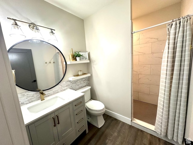 191 E 3475 N, North Ogden, UT 84414 - bathroom with wood finished floors, a tile shower, toilet, and vanity