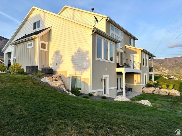 191 E 3475 N, North Ogden, UT 84414 - rear view of property featuring a balcony, a yard, and central air condition unit