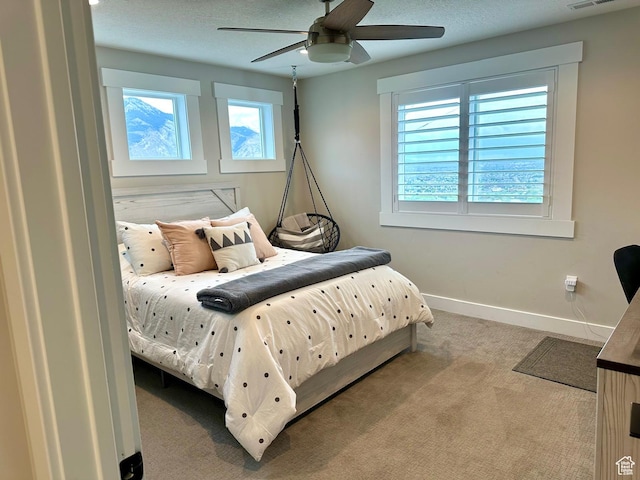 191 E 3475 N, North Ogden, UT 84414 - bedroom featuring multiple windows, carpet, baseboards, and ceiling fan