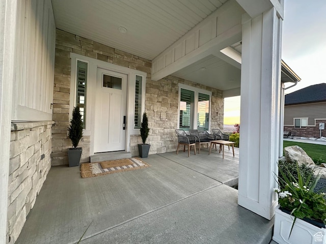 191 E 3475 N, North Ogden, UT 84414 - view of exterior entry featuring a porch and stone siding