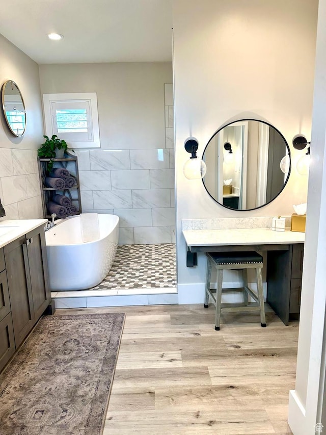191 E 3475 N, North Ogden, UT 84414 - bathroom with a soaking tub, wood finished floors, vanity, and tiled shower