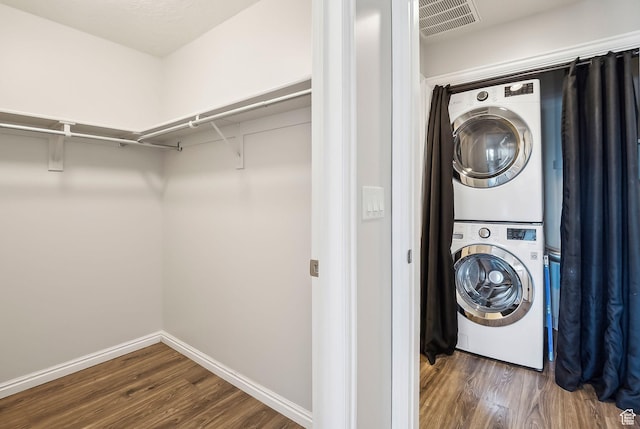 5 S 500 W Unit 506, Salt Lake City, UT 84101 - washroom featuring stacked washer / dryer, wood finished floors, and baseboards