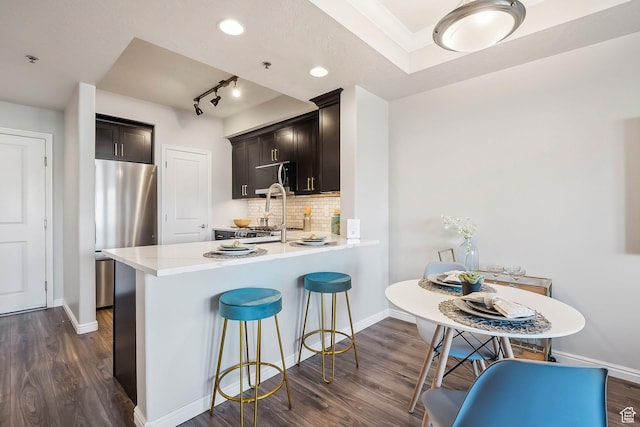 5 S 500 W Unit 506, Salt Lake City, UT 84101 - kitchen with freestanding refrigerator, dark wood finished floors, baseboards, light countertops, and recessed lighting